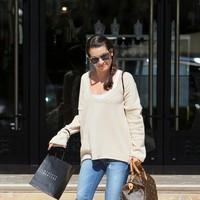 Lea Michele has her hands full as she leaves Barneys